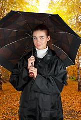 Image showing woman in rain coat