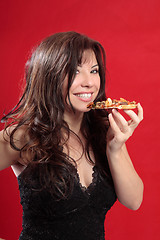 Image showing Attractive woman eating pizza