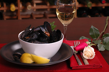 Image showing Bowl of mussels in a romantic setting