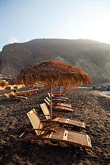 Image showing Sunbeds in Perissa, Santorini, Greece