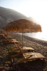 Image showing Sunbeds in Perissa, Santorini, Greece