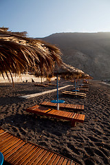 Image showing Sunbeds in Perissa, Santorini, Greece