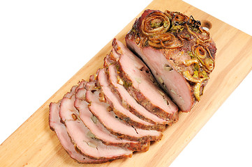 Image showing Roast pork on a wooden board