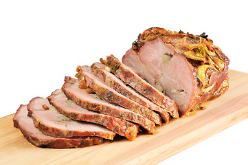 Image showing Roast pork on a wooden board