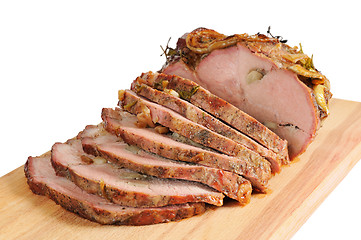 Image showing Roast pork on a wooden board