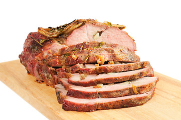 Image showing Roast pork on a wooden board