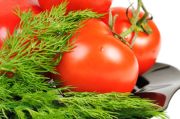 Image showing Tomatoes on a black plate