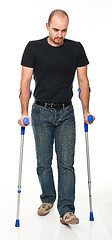 Image showing man with crutch