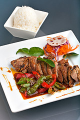 Image showing Thai Chile Basil Duck Dish with Rice