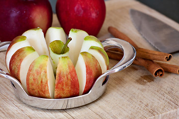 Image showing Freshly Sliced Apples and Cinnamon Sticks