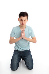 Image showing Kneeling in prayer