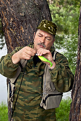 Image showing Fisherman with spinning and lure