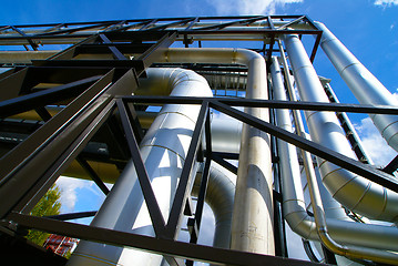 Image showing Industrial zone, Steel pipelines and valves against blue sky