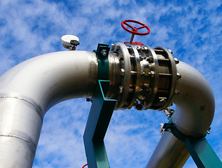 Image showing Industrial zone, Steel pipelines and valves against blue sky