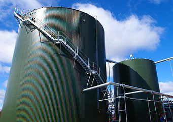 Image showing Industrial zone, Steel pipelines and tanks against blue sky