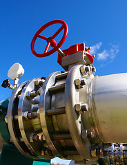 Image showing Industrial zone, Steel pipelines and valves against blue sky