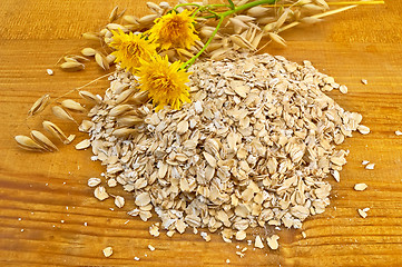 Image showing Oatmeal with stalks of oats