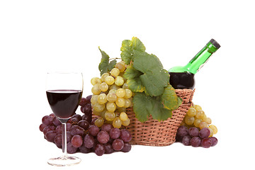 Image showing white and red grape with leaves and bottle of wine