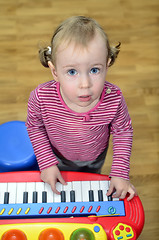 Image showing little girl playing the piano