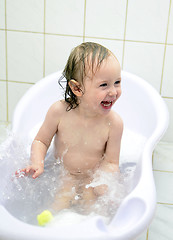 Image showing little girl having fun in the bathroom