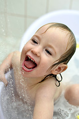 Image showing little girl having fun in the bathroom