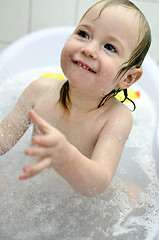 Image showing little girl having fun in the bathroom