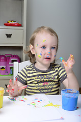 Image showing little girl and colored paints