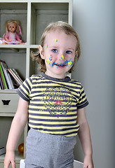 Image showing little girl and colored paints