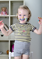 Image showing little girl and colored paints