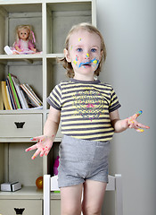 Image showing little girl and colored paints 