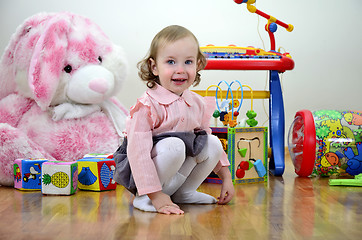 Image showing little girl in a room with toys