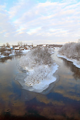 Image showing snow village on coast river