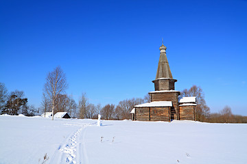 Image showing wooden chapel on snow field