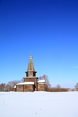 Image showing wooden chapel on snow field