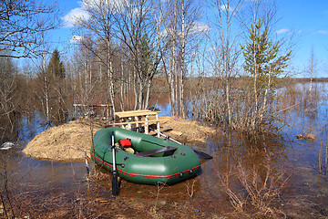 Image showing rubber boat on coast river