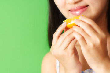 Image showing Eating orange