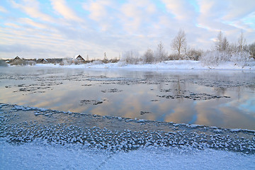 Image showing winter village on coast river 