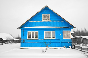 Image showing blue house amongst white snow