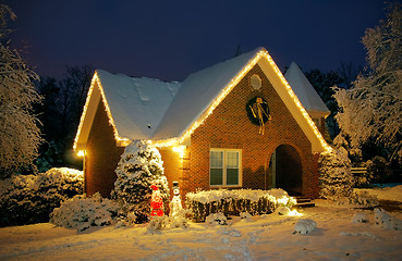 Image showing Christmas decorated cottage at night