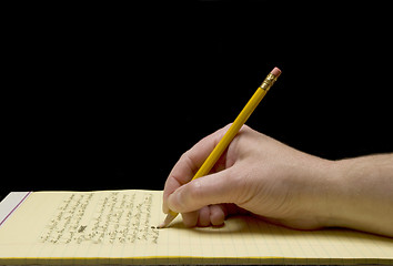 Image showing Handwriting with broken pencil point on yellow paper