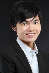 Image showing Young asian man in black suit