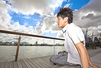 Image showing asian man sitting in park