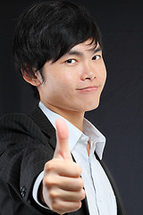 Image showing portrait of young man in suit and thumbs up