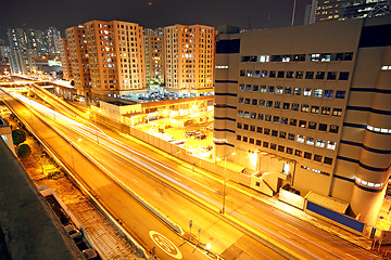 Image showing urban landscape at night and through the city traffic 