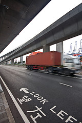 Image showing speed container car moving under the overpass