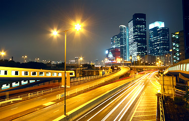 Image showing urban landscape at night and through the city traffic 