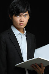 Image showing asia man holding folder