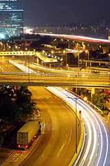 Image showing urban landscape at night and through the city traffic 