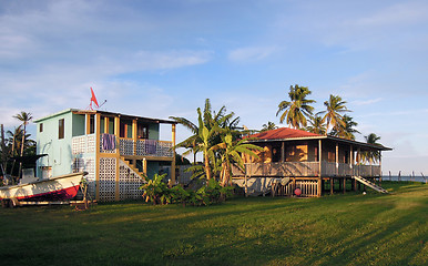 Image showing two waterfront houses with palm trees Corn Island Nicaragua