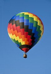 Image showing Colorful hot-air balloon against blue sky
